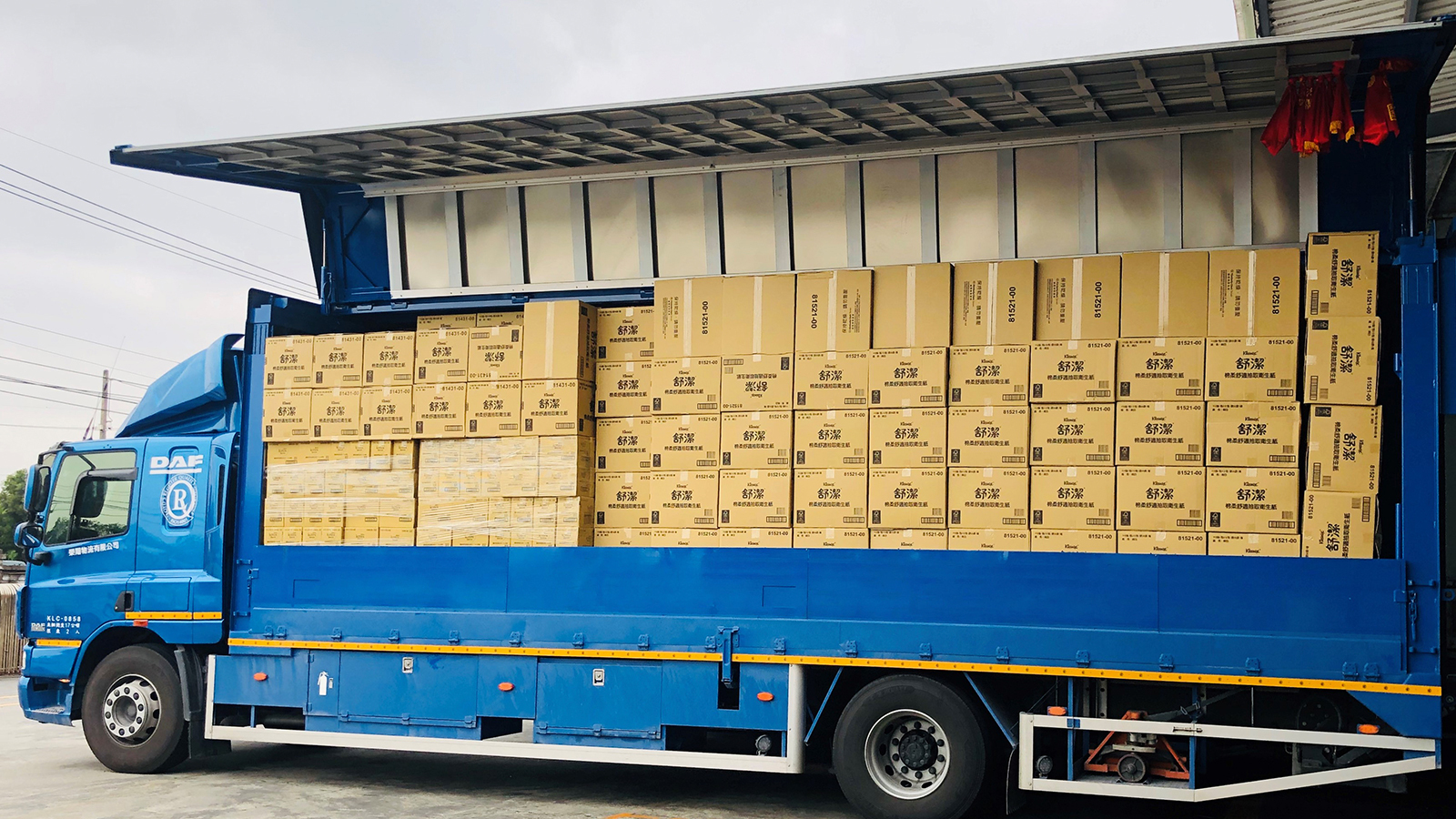 Delivery truck loaded with boxes of rolled paper towels