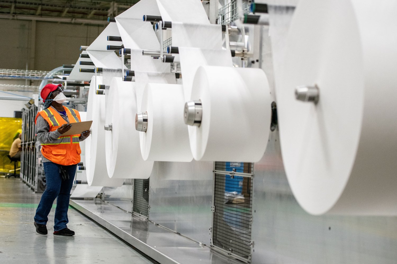 African-American paper factory worker wearing Kimtech® pouch-style respirator