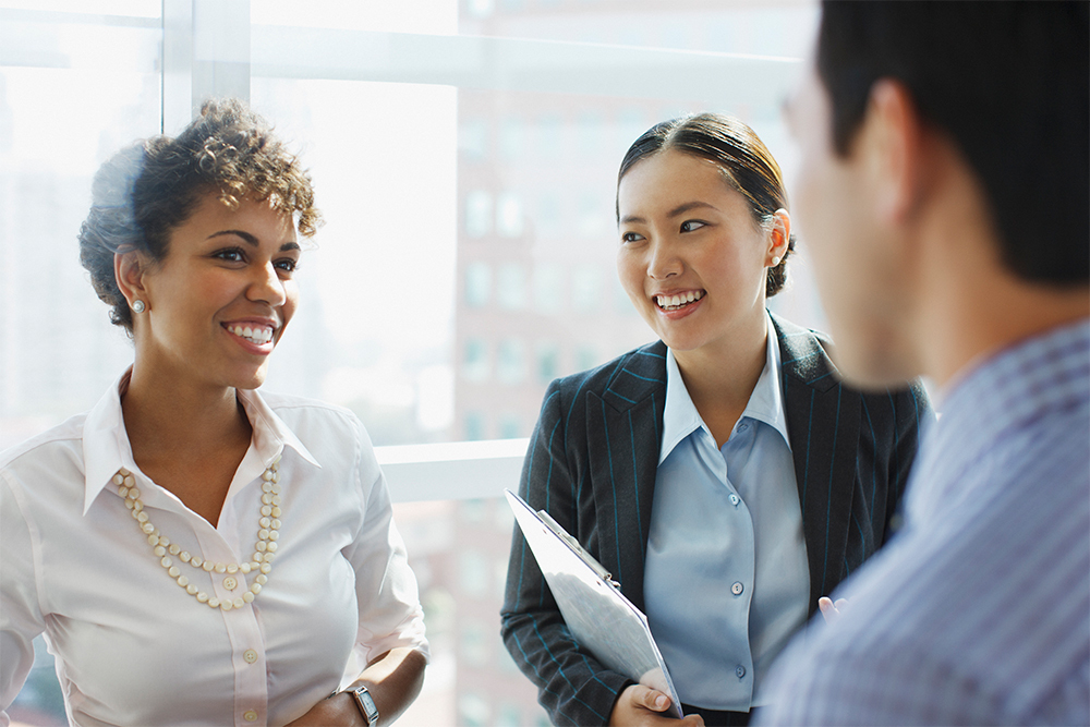 How to buy-Business Women Talking in Front of Window image-ID