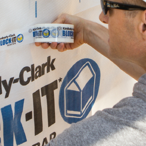 Construction worker applying BLOCK-IT® Seam Tape