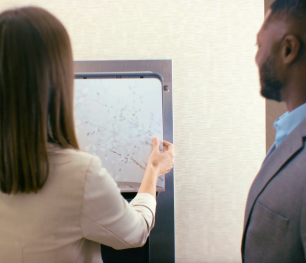Strategic Support – Kimberly-Clark Professional sales consultant presenting restroom design solutions to a customer 